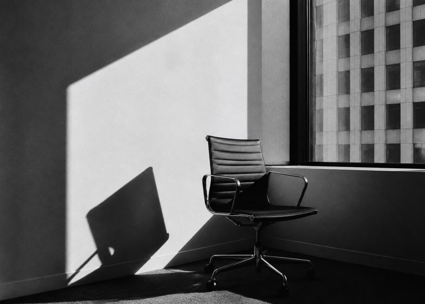 Burnout therapy in Nashville: an empty office chair by a window in afternoon light